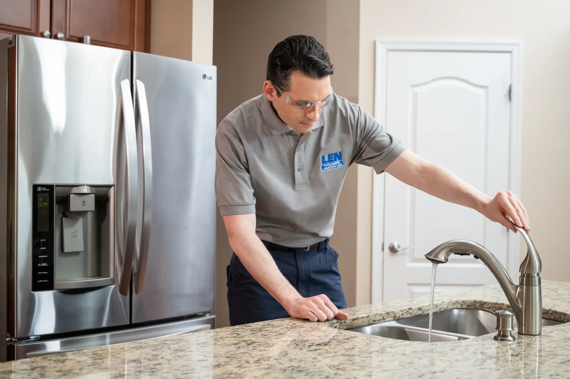 Plumber taking care of client home with floor protection and professional service