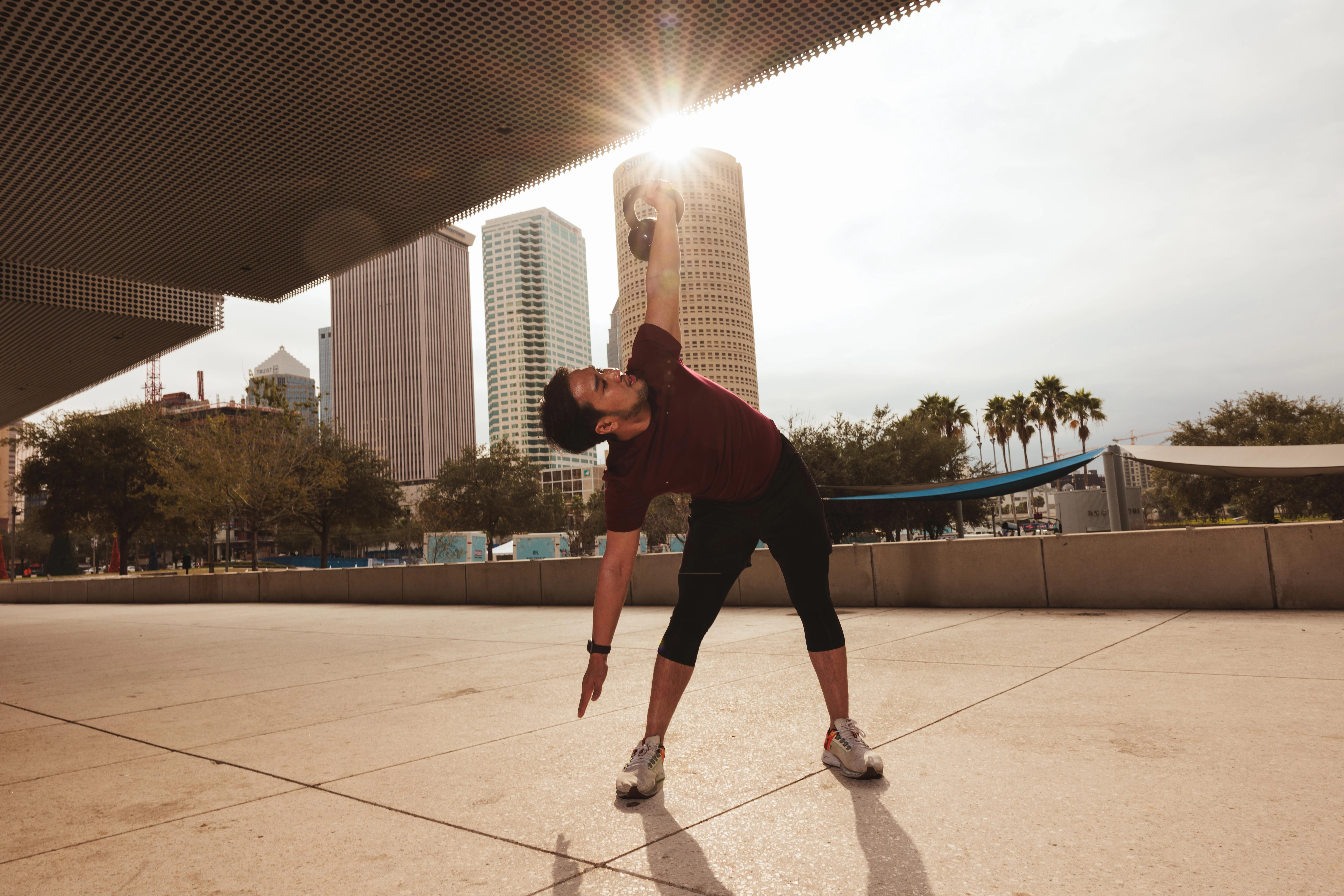 Athlete training outdoors against an urban skyline